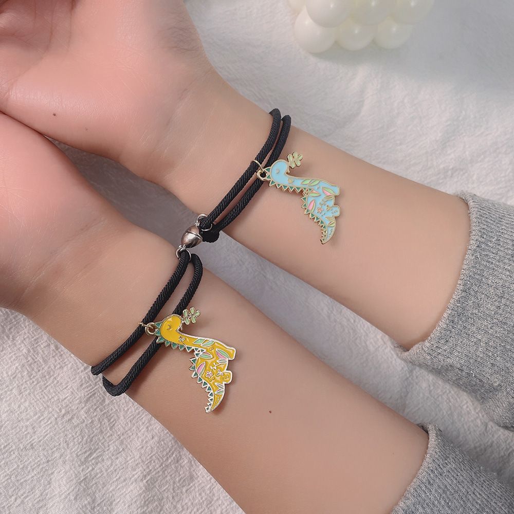 New Simple Cartoon Oil Dinosaur Iron-absorbing Love Couple Hands Carrying Strap